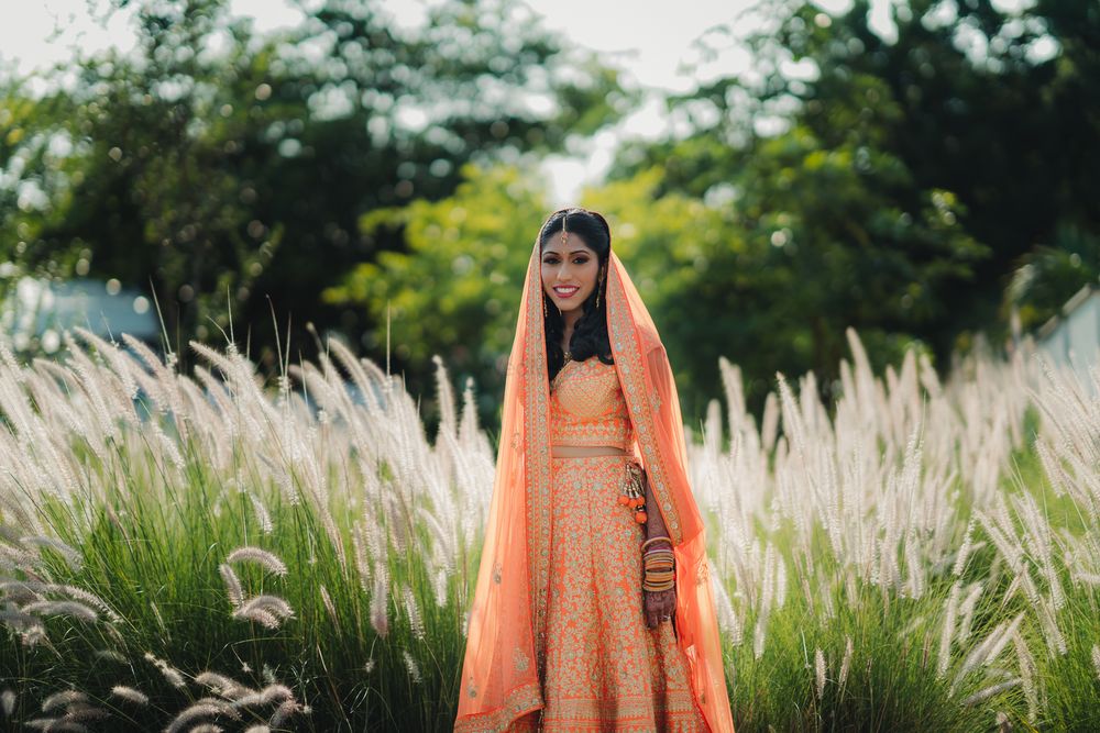 Photo of Neon orange bridal lehenga