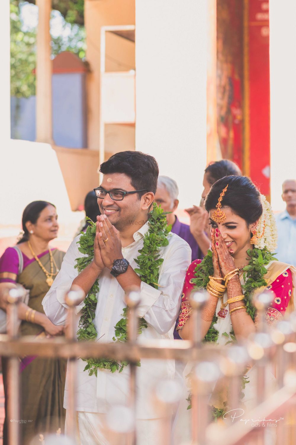 Photo of A south Indian couple praying on their wedding day