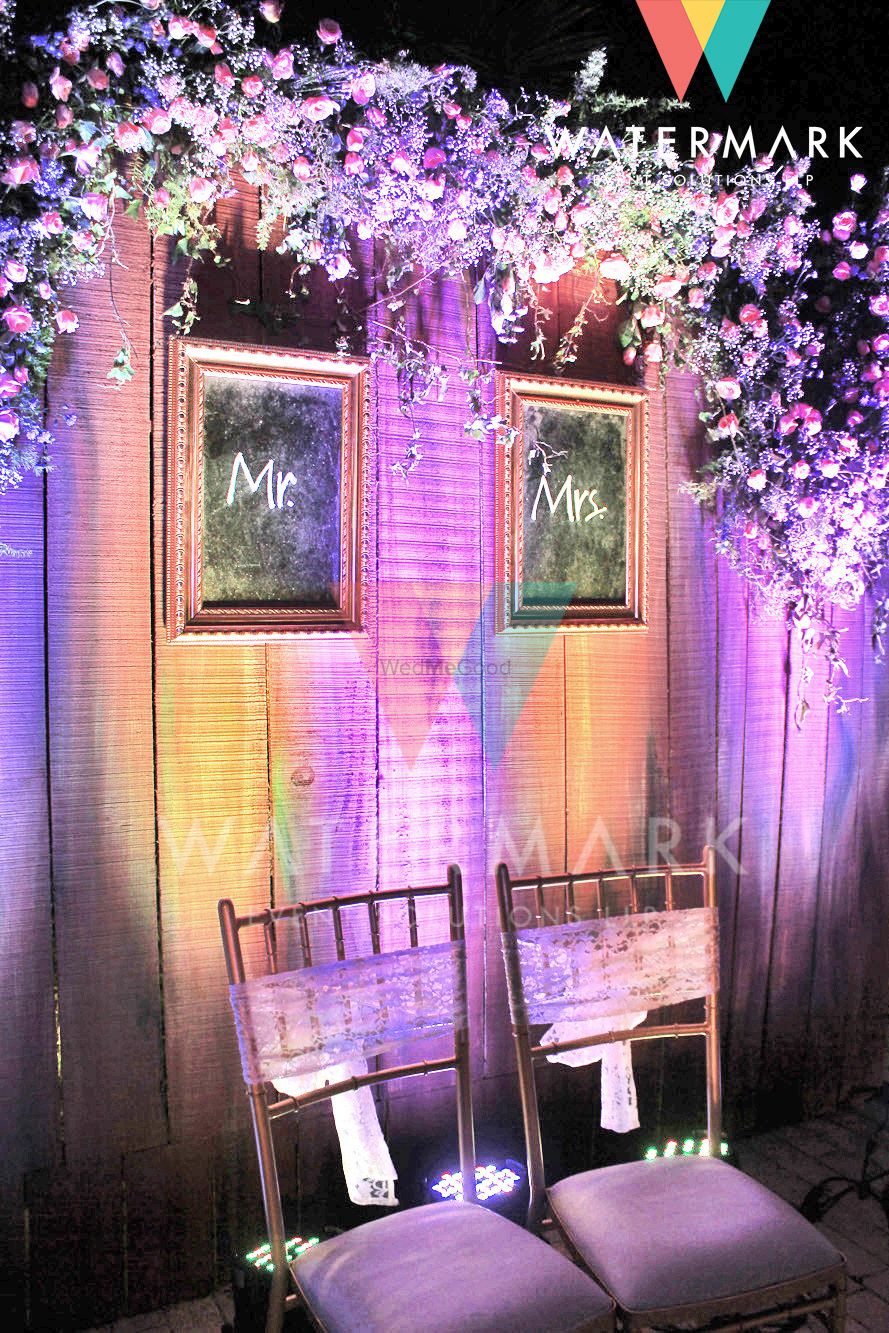 Photo of bride and groom chairs