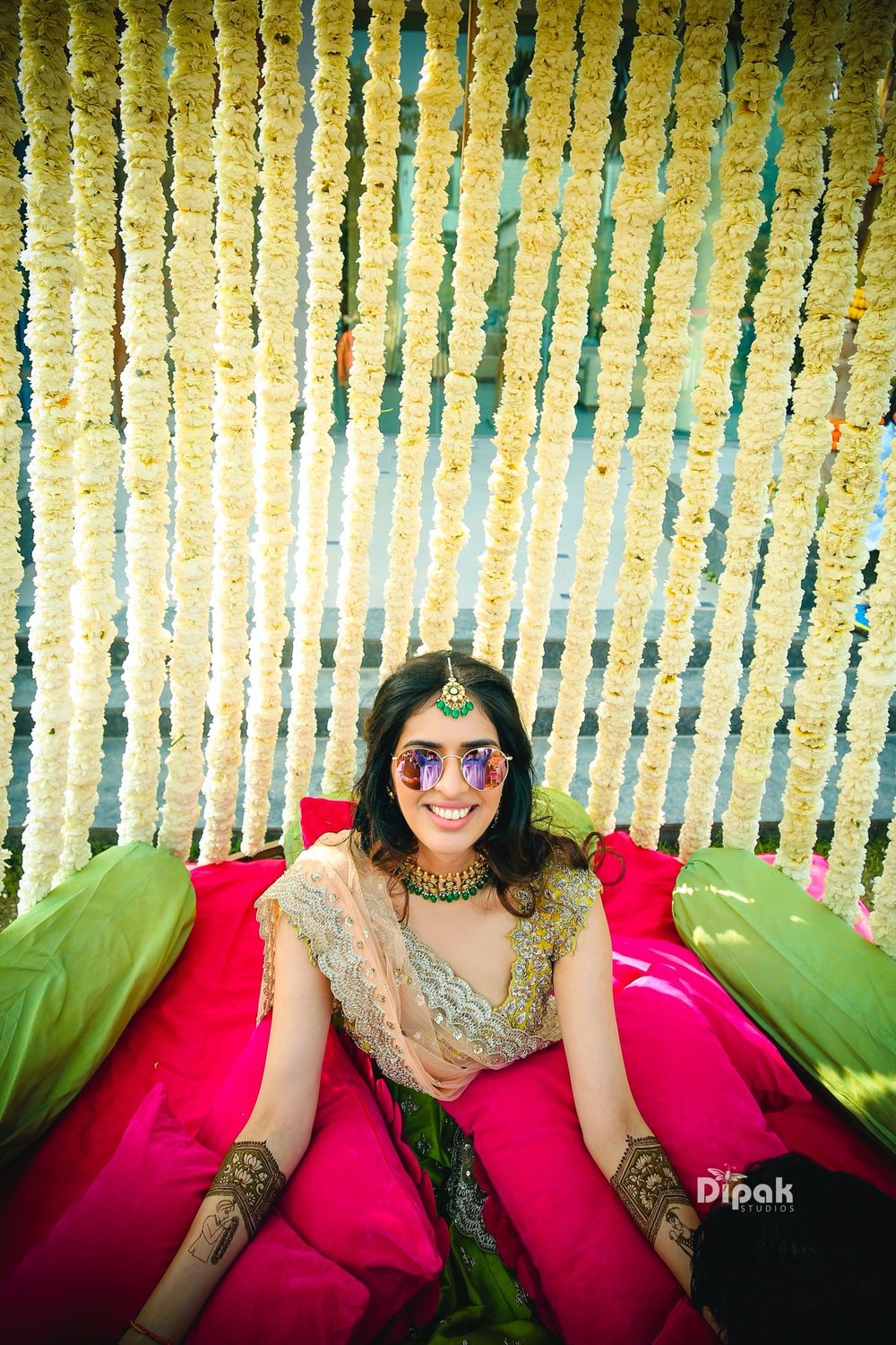 Photo of Bride mehendi with photobooth and sunglasses shot