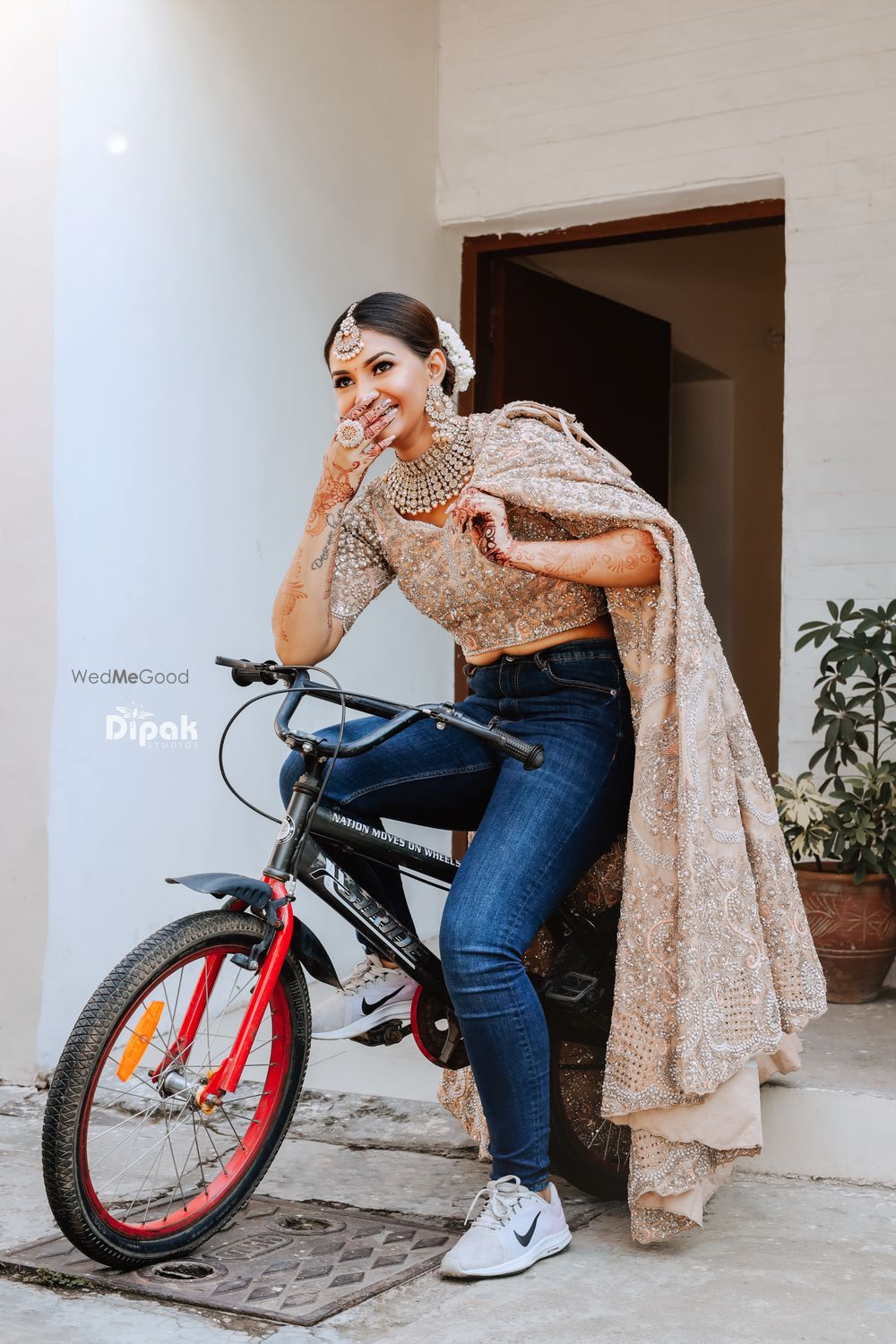 Photo of bride getting ready shot idea with a cycle