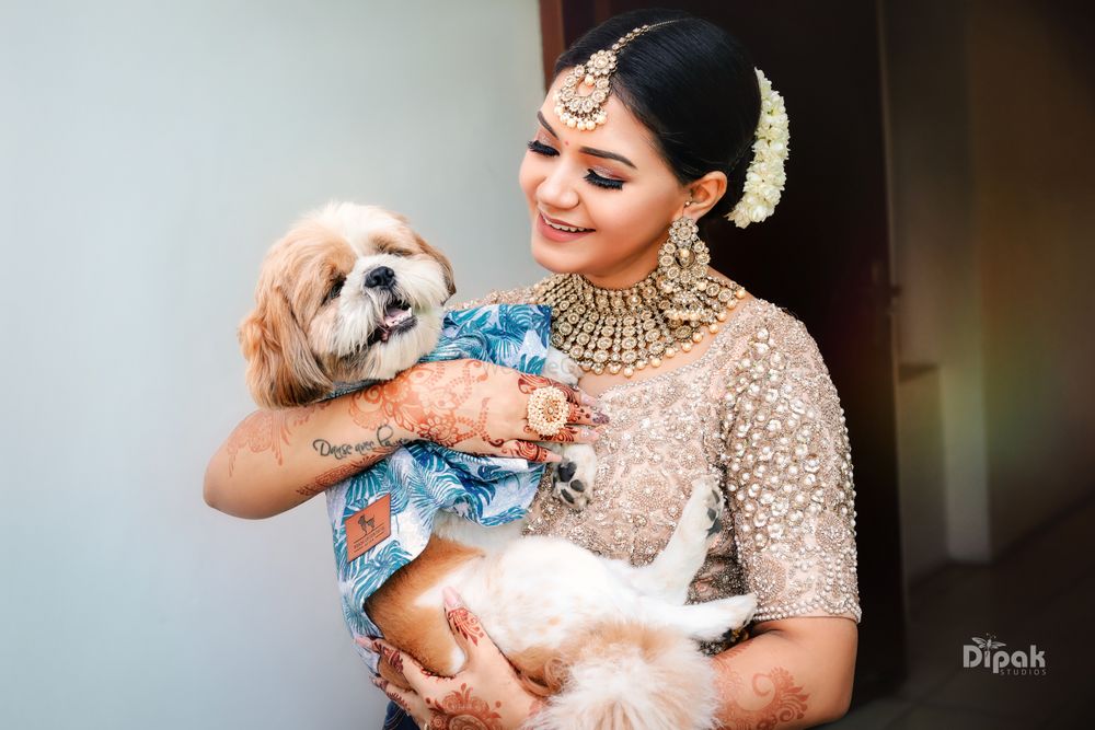 Photo of bride and her dog shot before the wedding