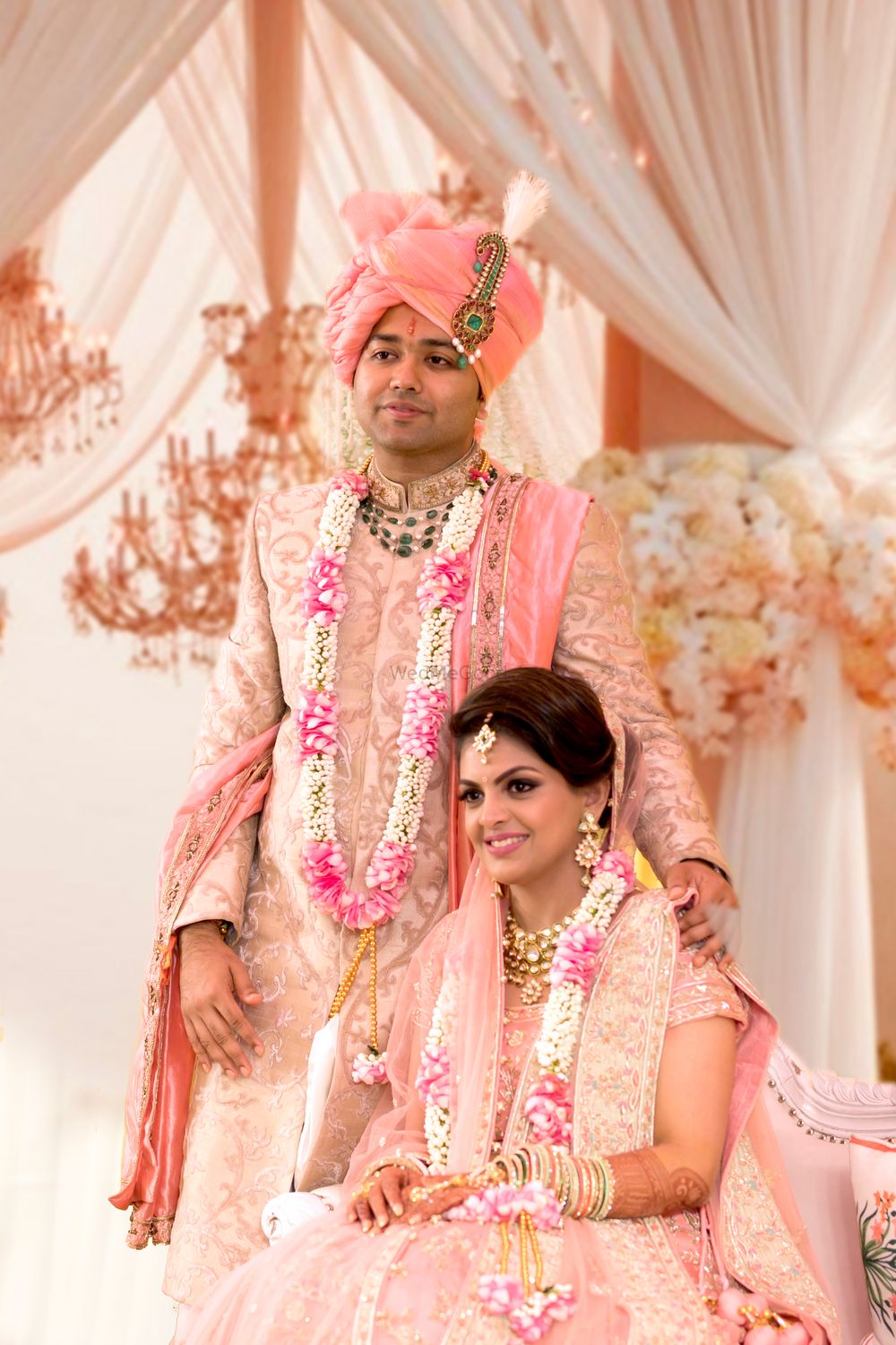Photo of Bride and groom in pastel outfits for wedding