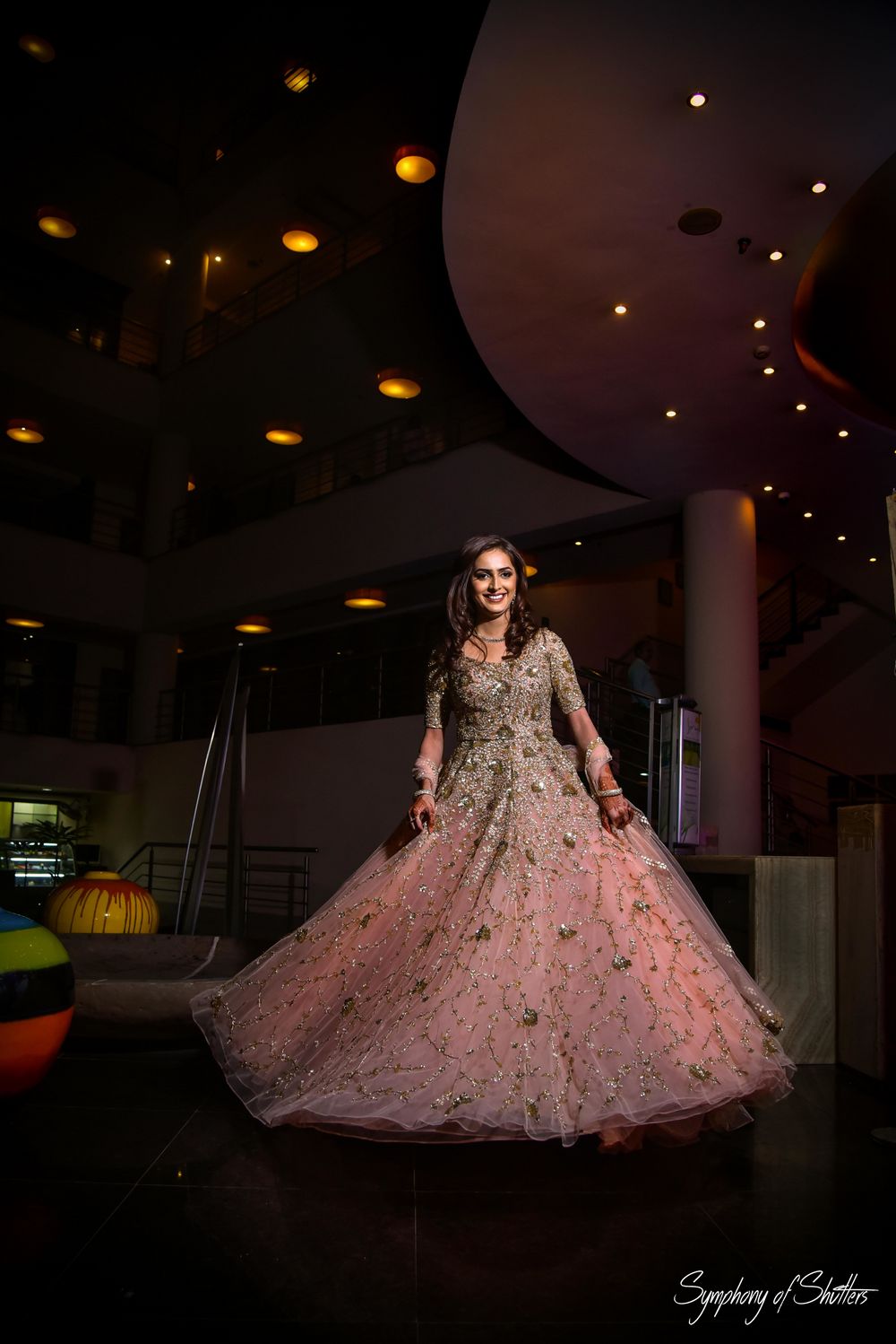 Photo of Pretty bride in peach and golden gown for engagement