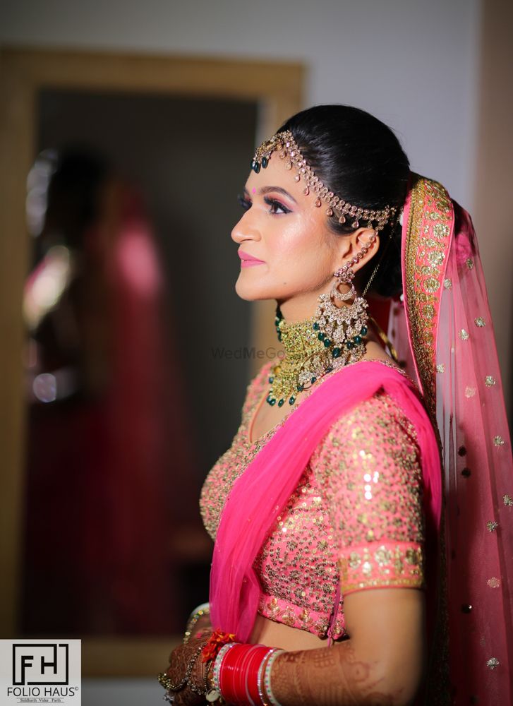 Photo of A bride in light pink lehenga