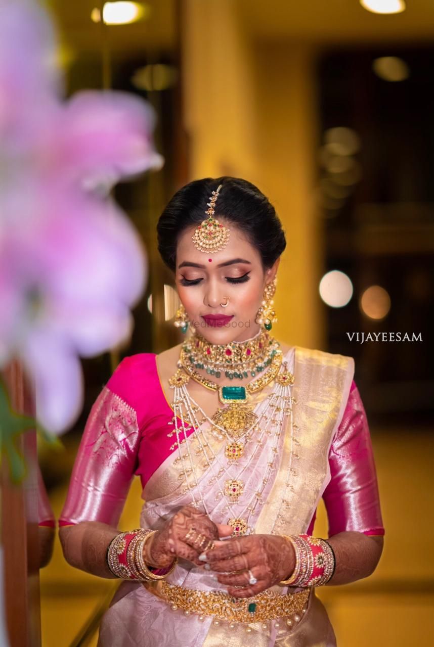Photo of Light pink and gold saree with the contrasting pink blouse