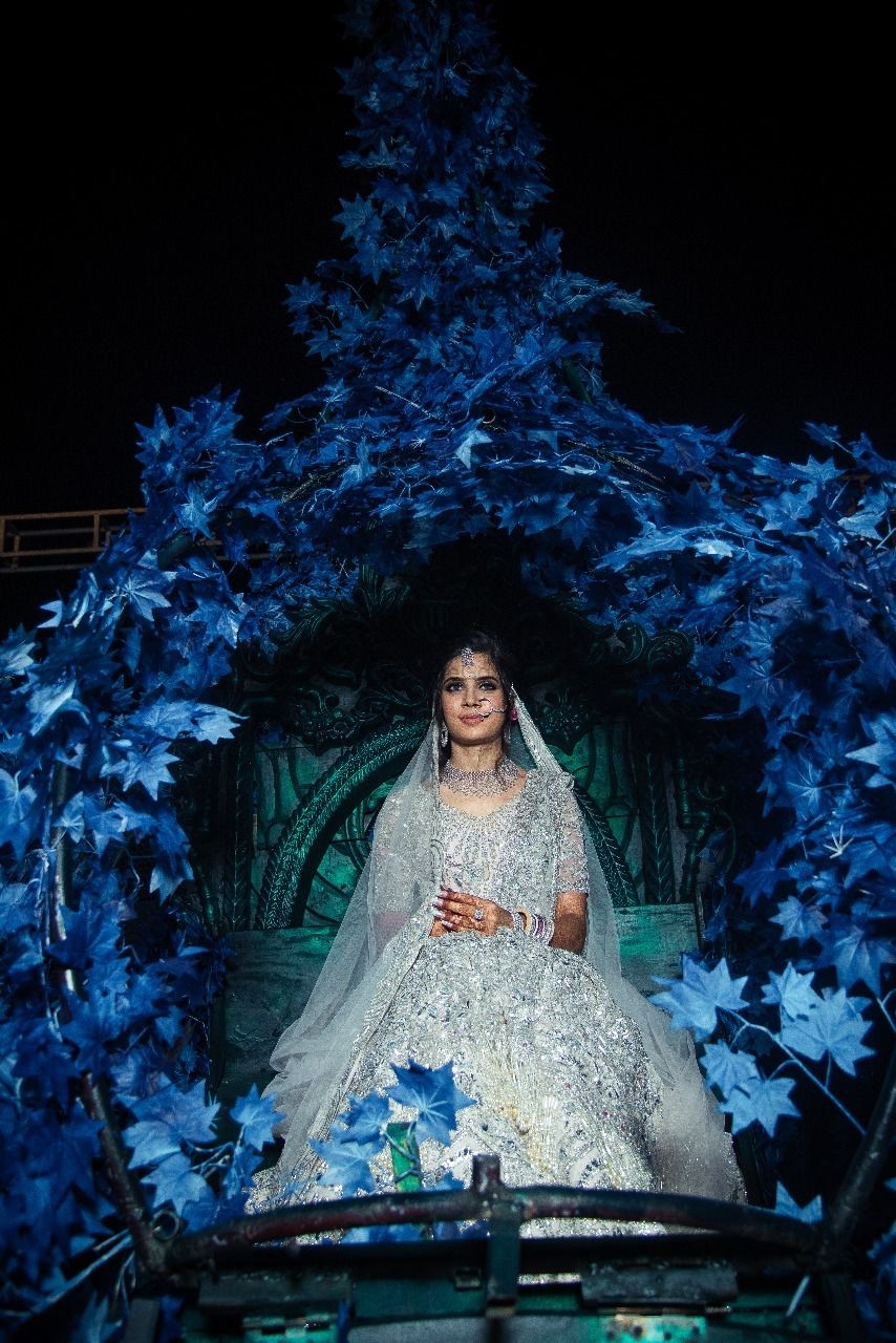 Photo of Unique bridal entry with bride in grey lehenga