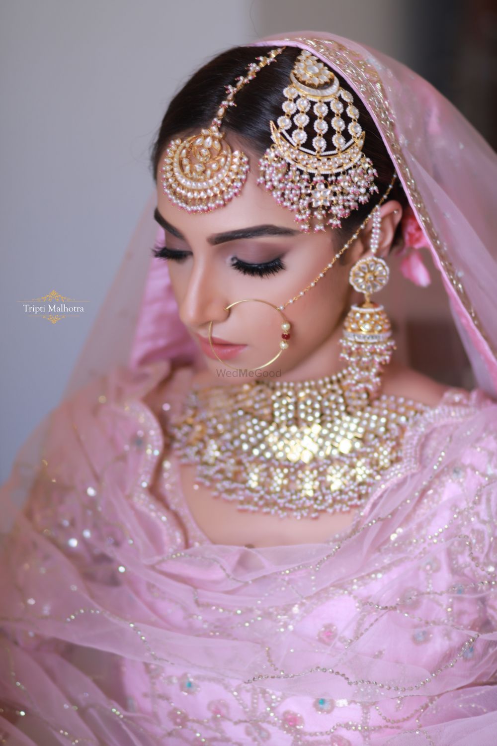 Photo of Sikh bride with pastel jewellery and jhoomer