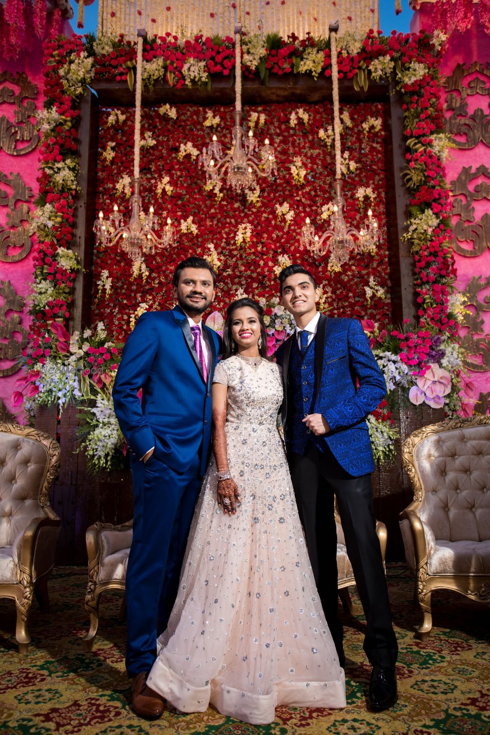 Photo of Engagement decor with floral wall and chandelier