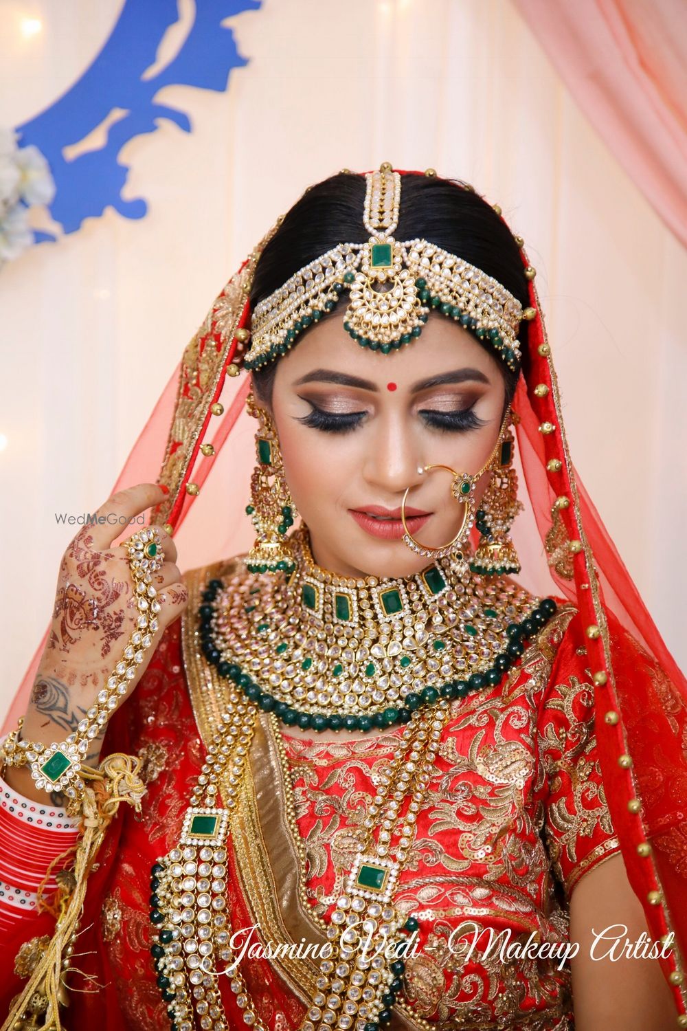 Photo of A bride in red and heavy jewellery