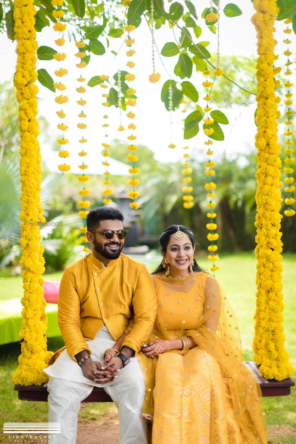 Photo of Haldi seating with matching bride and groom