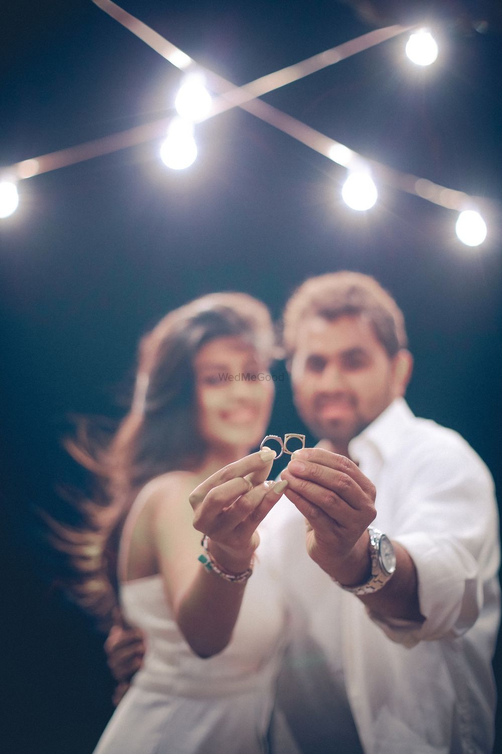 Photo of Engagement ring photography couple shot