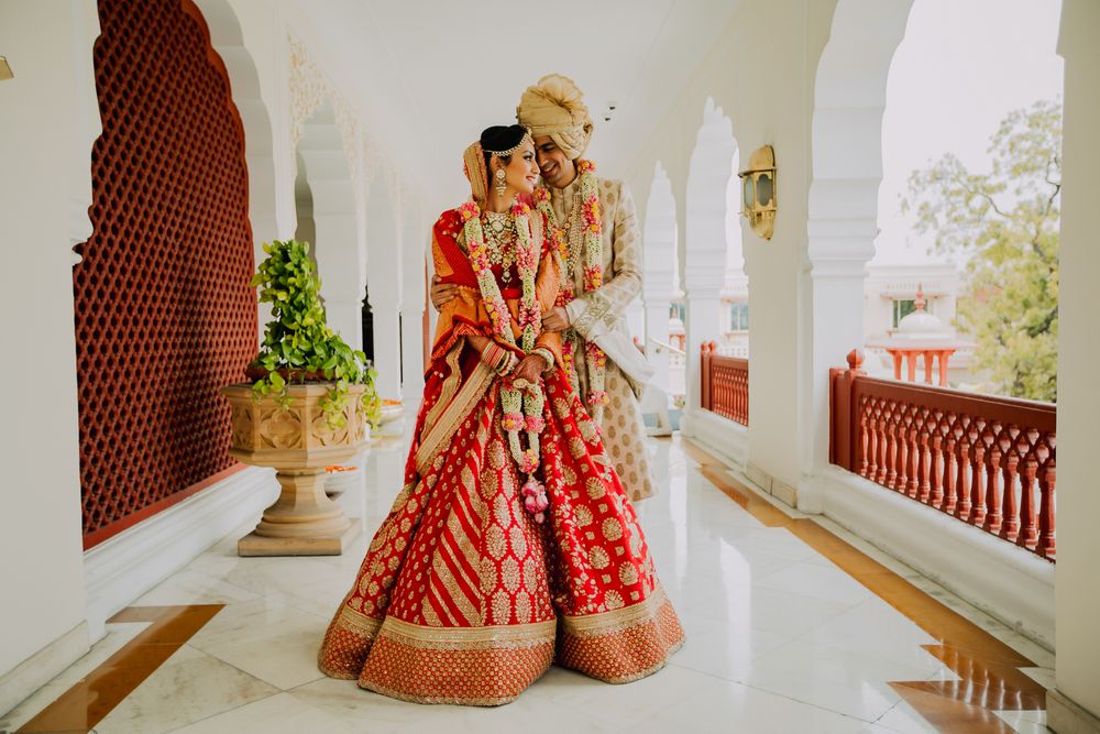 Photo of A bride and groom with pretty jaimala