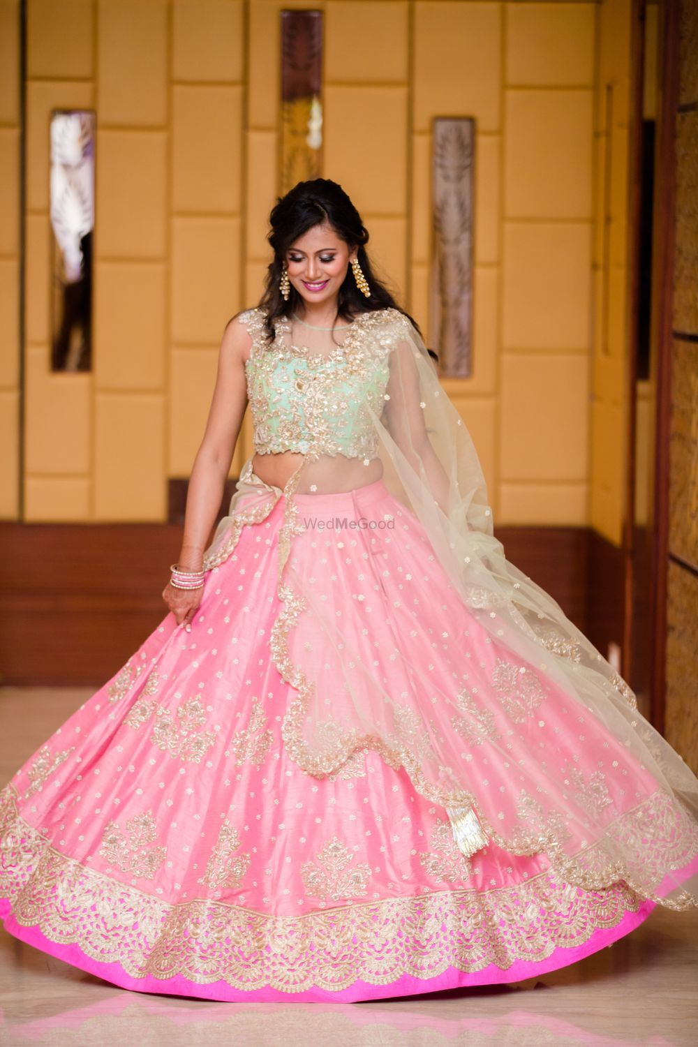 Photo of Bride in mint and pink pastel engagement lehenga