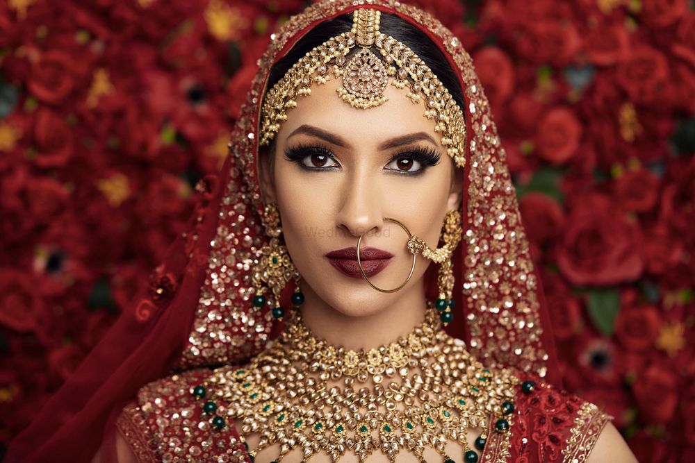 Photo of A bride in red lehenga and heavy jewellery