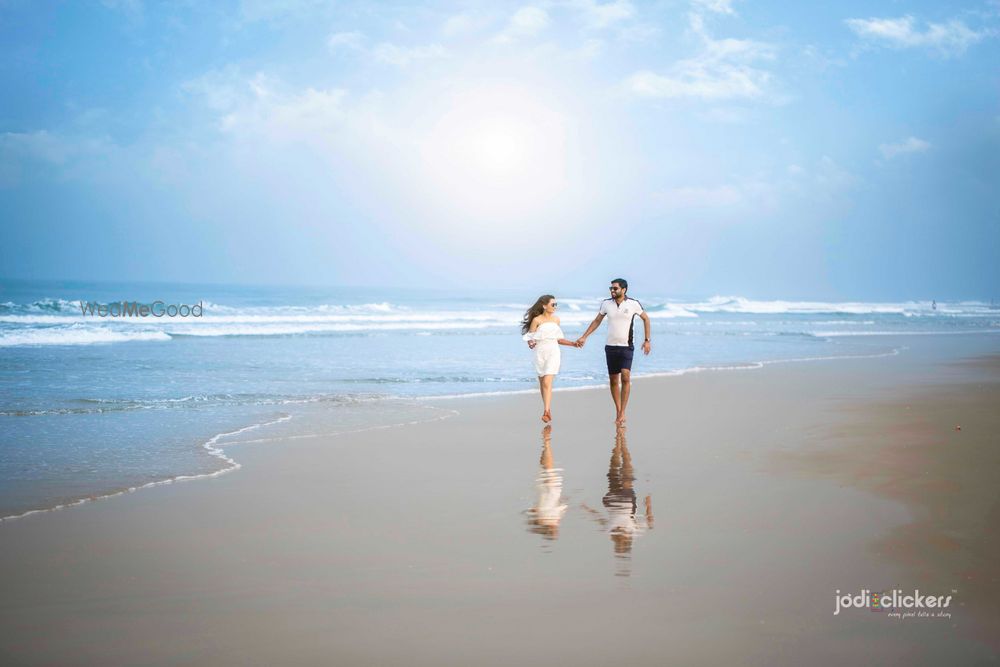 Photo of Pre wedding shoot on beach with honeymoon shot