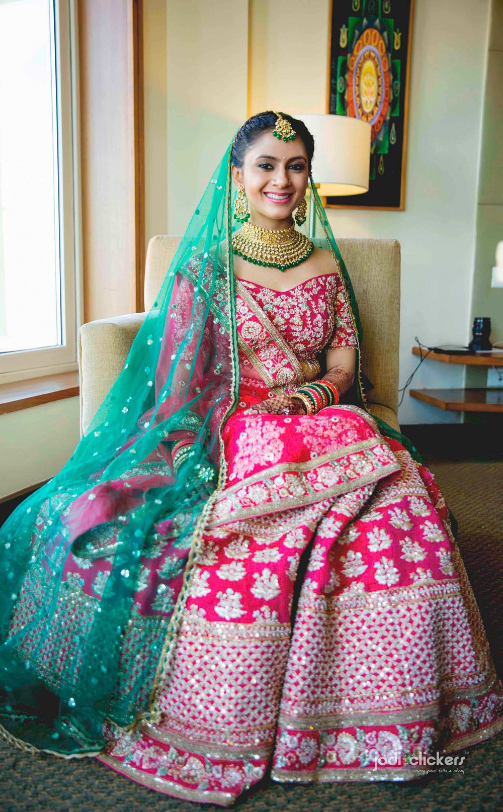 Photo of Off shoulder blouse with red and green lehenga