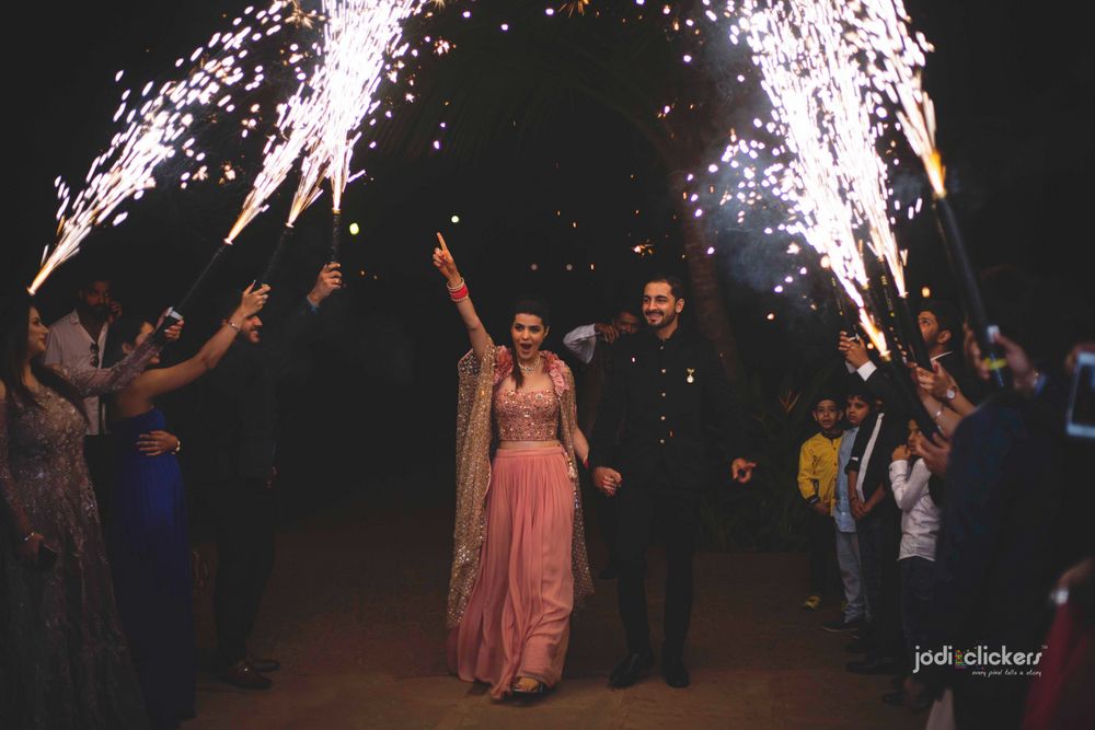 Photo of Reception idea with guests holding cold pyros