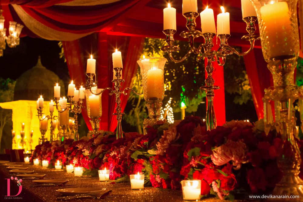 Photo of red and gold table settings