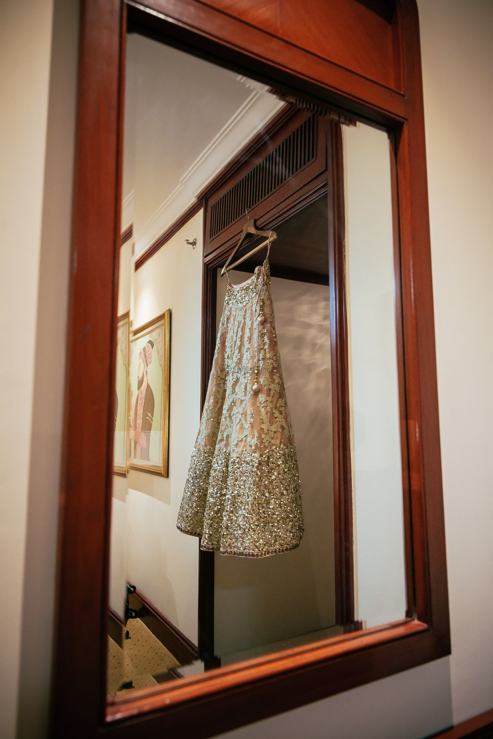 Photo of Champagne Pink and Gold Lehenga on a Hanger