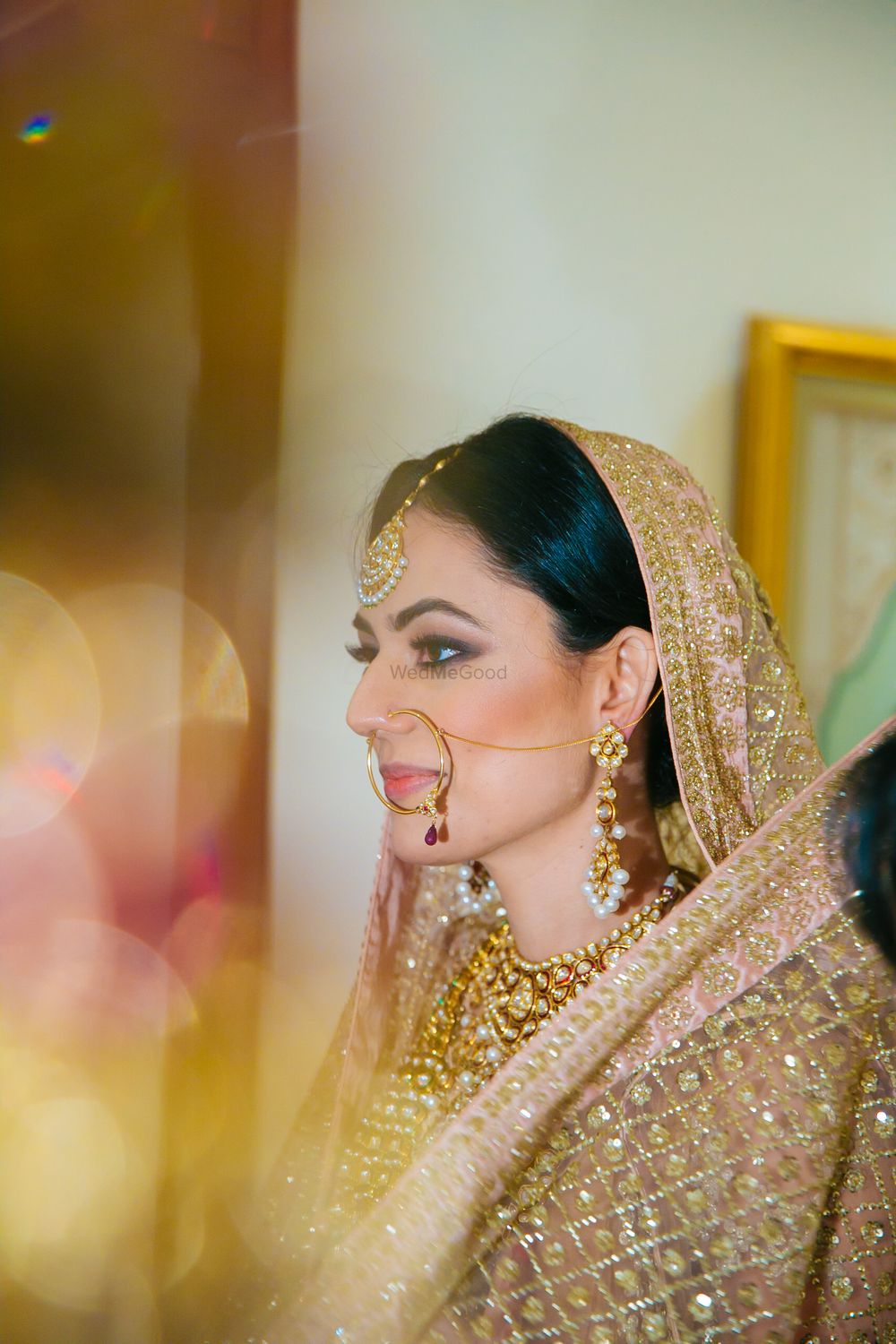 Photo of Champagne Pink Dupatta with Gold Jewelry