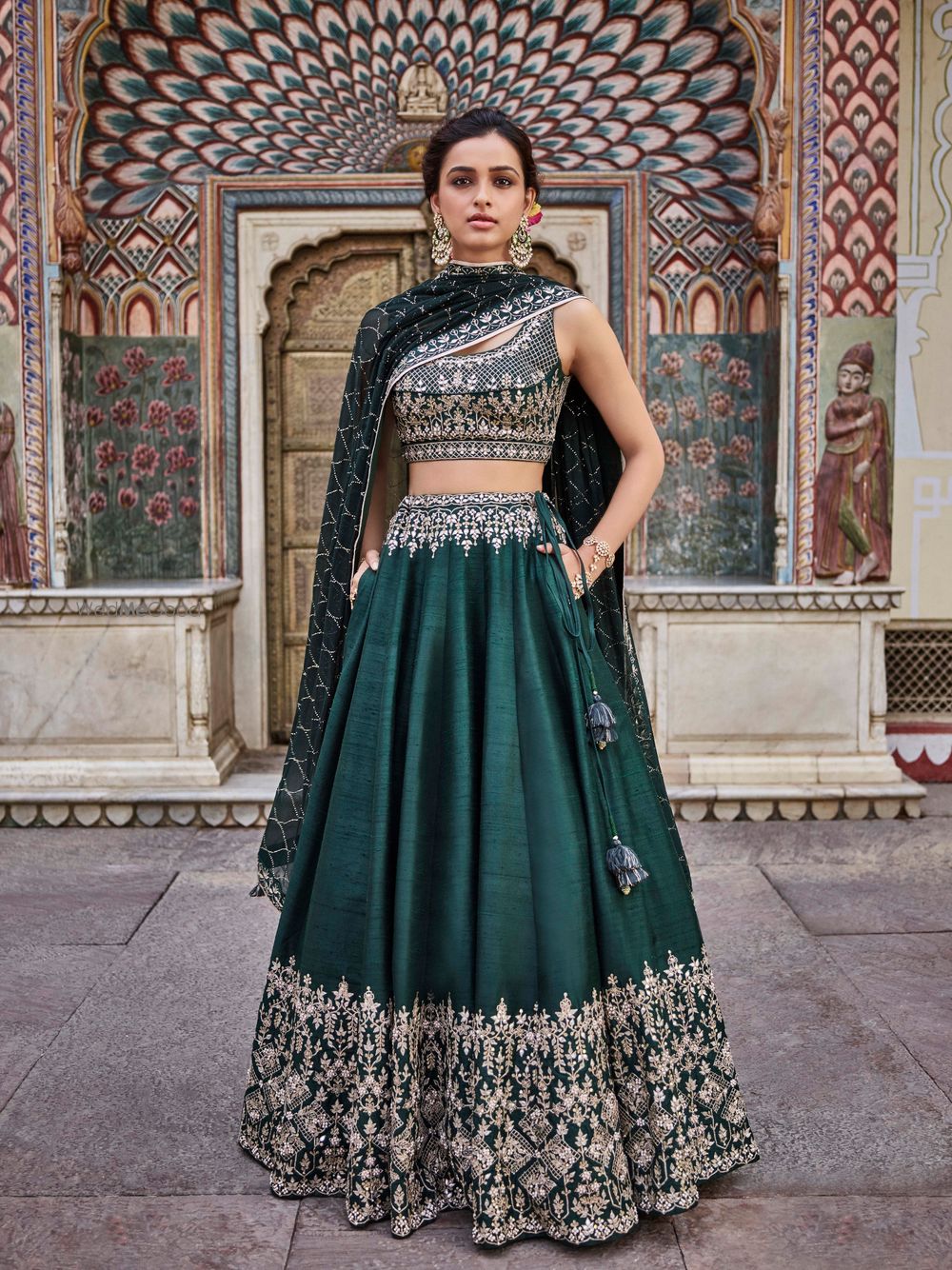 Photo of Dark green lehenga with pockets for mehendi or sangeet