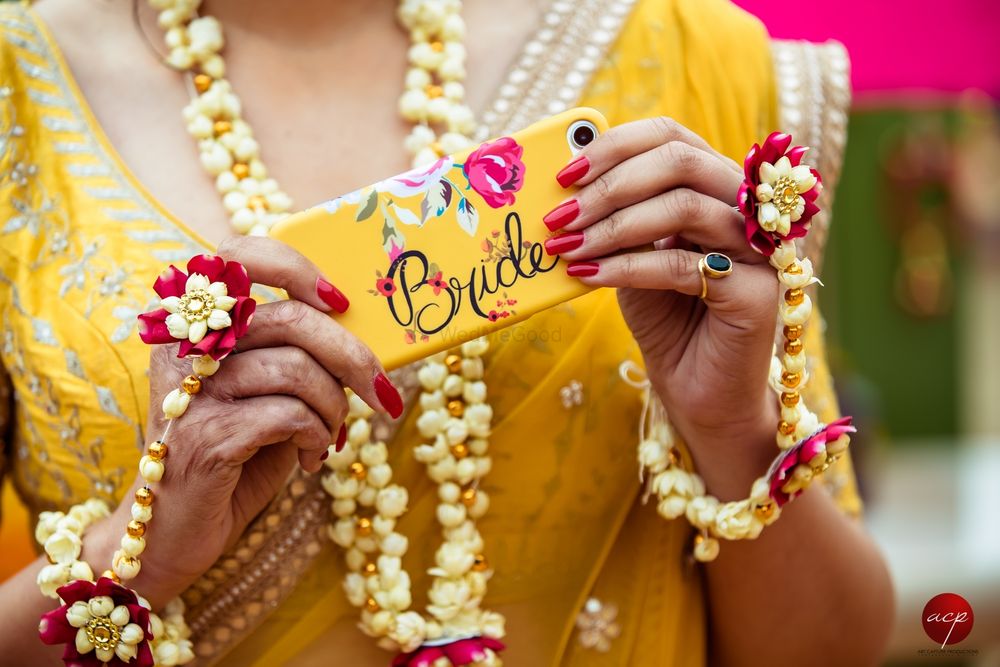 Photo of Bride accessory yellow phone cover