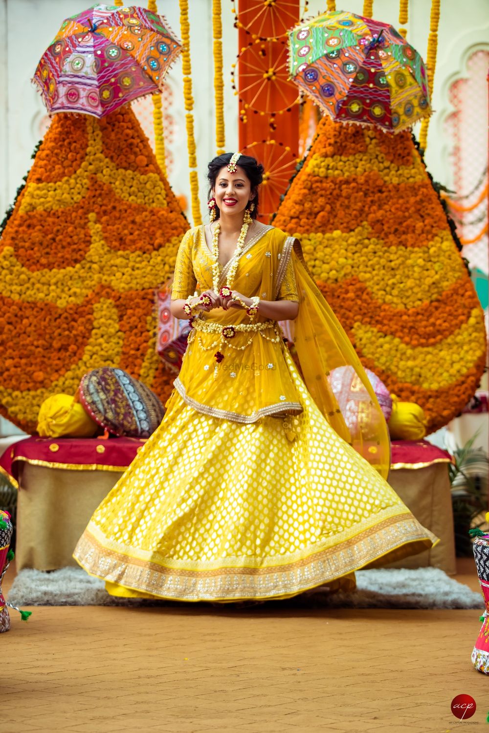 Photo of Mehendi bridal look in yellow lehenga and floral jewellery