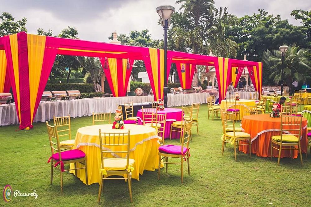 Photo of Bright pink and yellow theme outdoor setting
