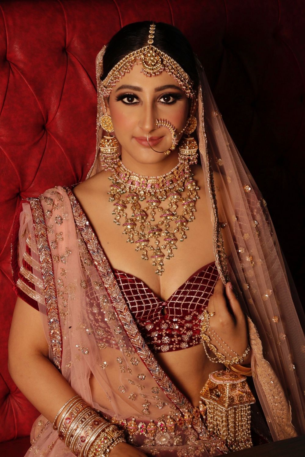 Photo of Maroon bride with unique blouse and jewellery