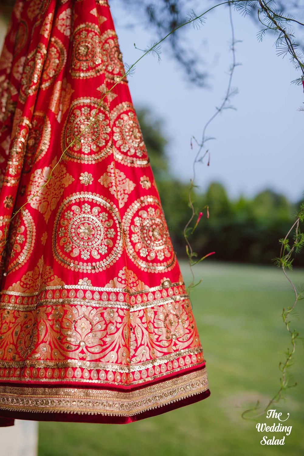 Photo of Red benarasi lehenga on hanger