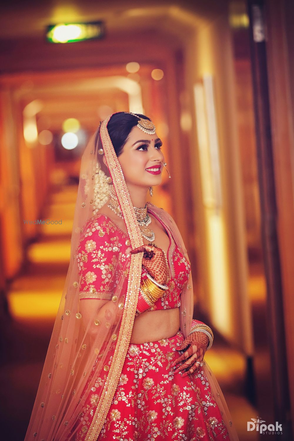 Photo of Wedding day bridal portrait in red