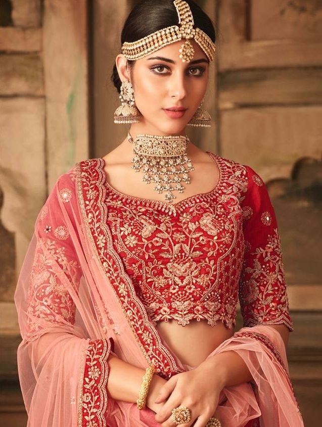 Photo of Pretty red bridal lehenga with unique choker necklace