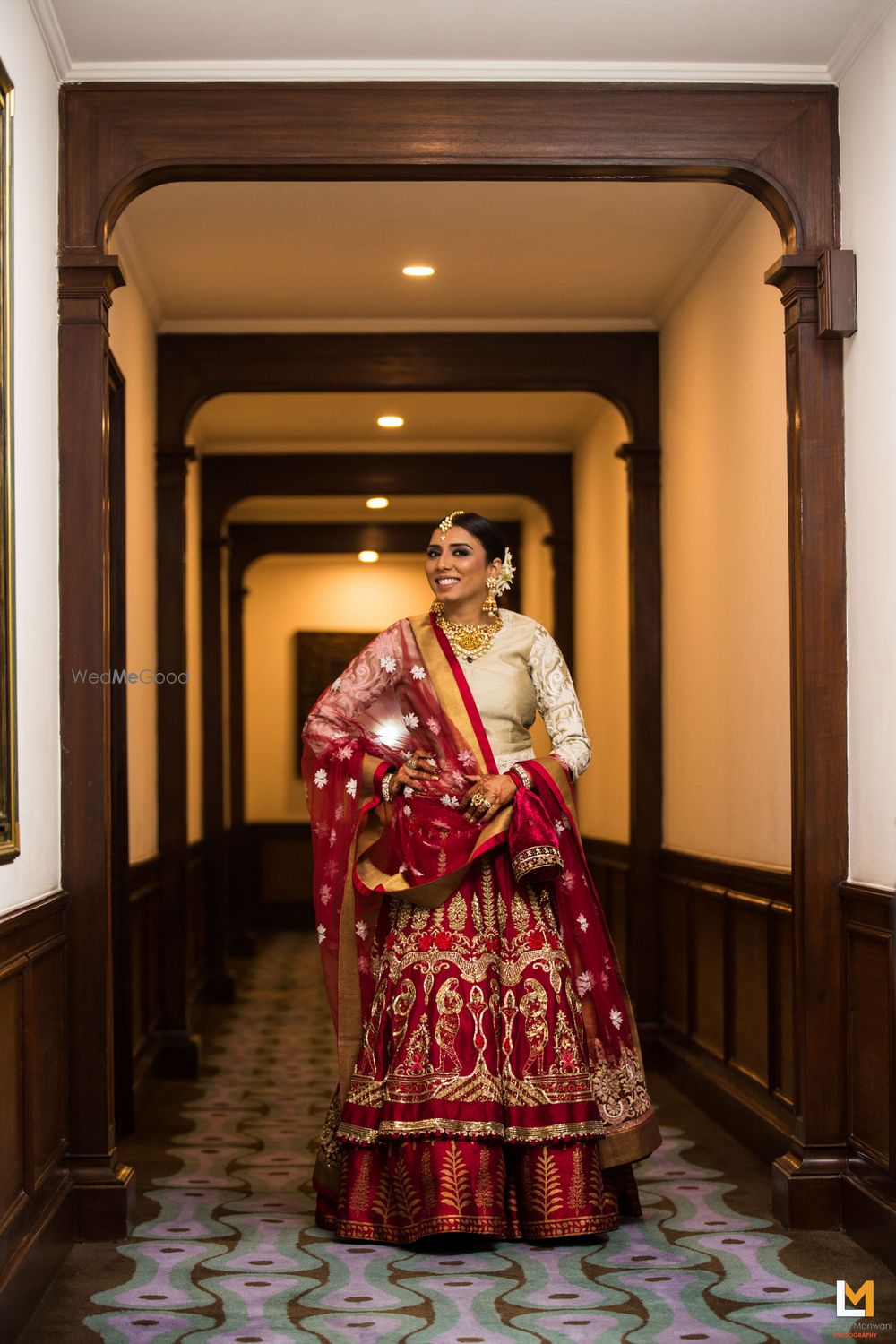 Photo of maroon and gold bridal lehenga