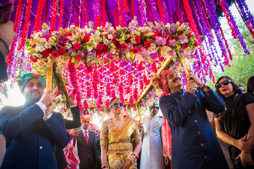 Photo of South indian bride enters under a phoolon ki chadar