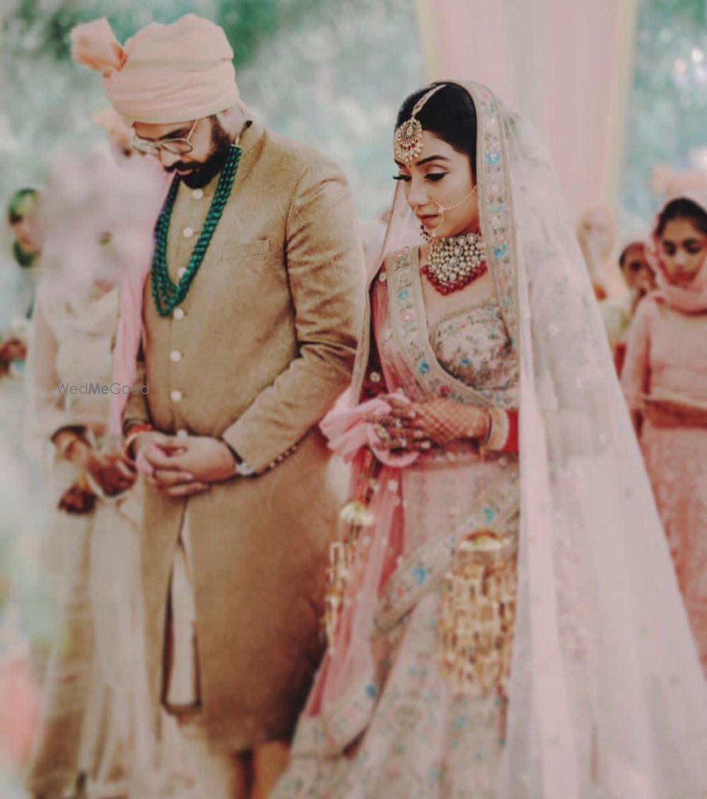 Photo of Light pink lehenga with blue embroidery