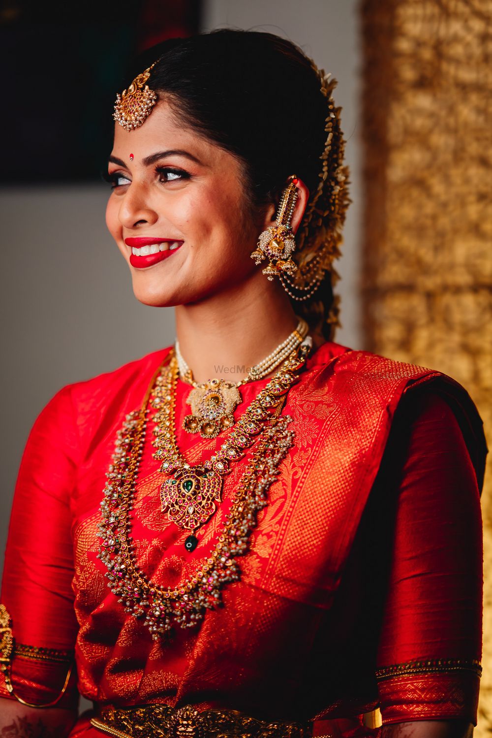 Photo of Pretty South Indian bridal look in red