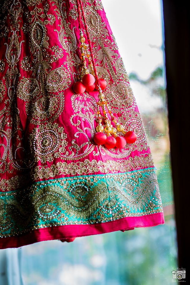 Photo of pink and turquoise bridal lehenga