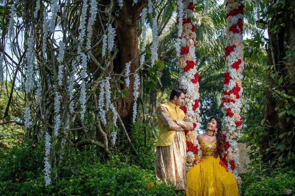 Photo of Mehendi floral swing decor idea with couple