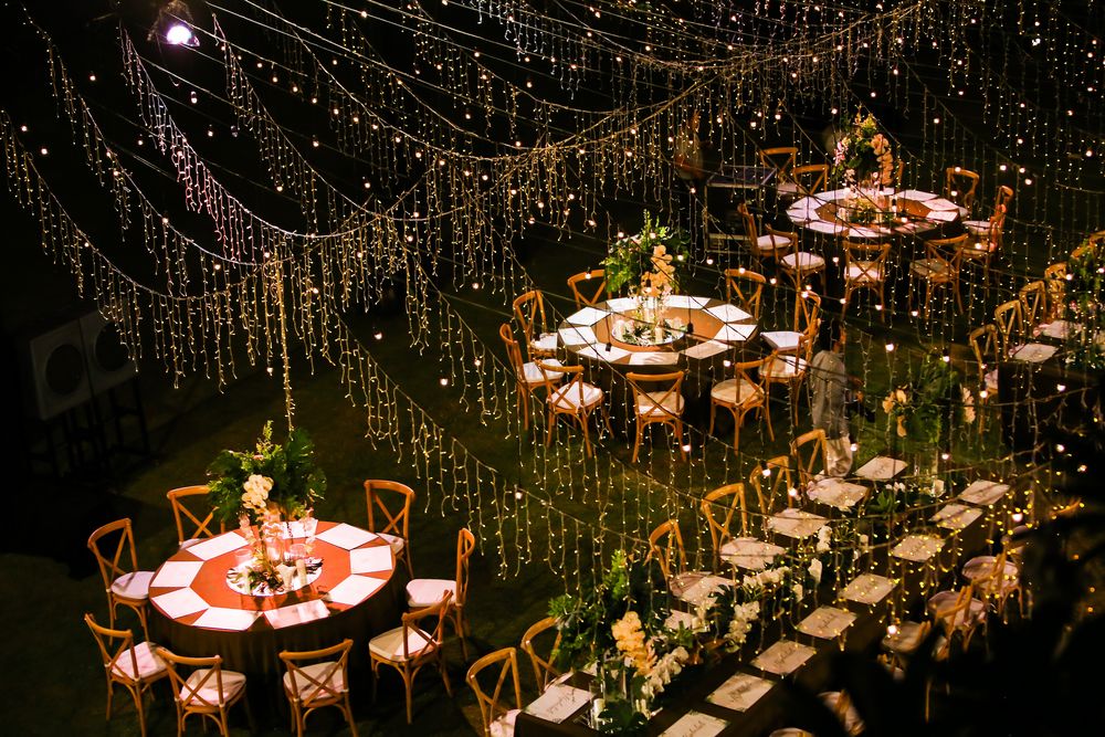 Photo of Long table setting with fairy lights all over