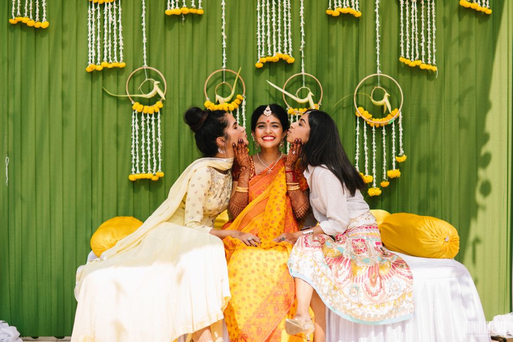 Photo of A bride on her haldi function with her bridesmaids