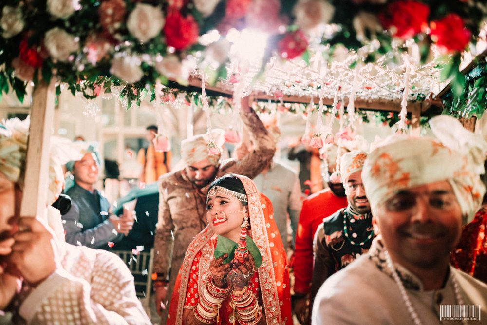 Photo of A Bengali bride enters under a phoolon ki chaadar