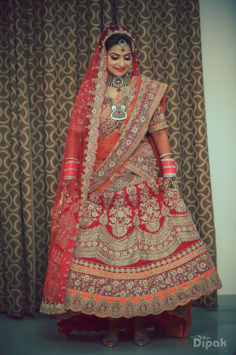 Photo of Red and Orange Lehenga with Gold Embroidery