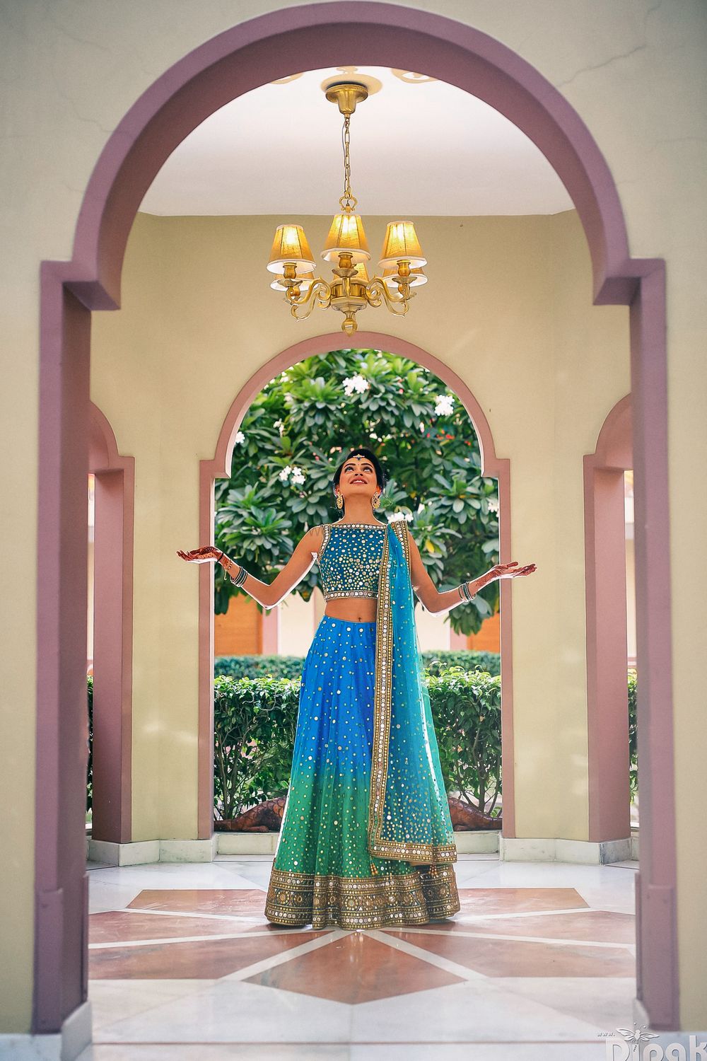 Photo of Blue and turquoise ombre lehenga with mirror work and gold border