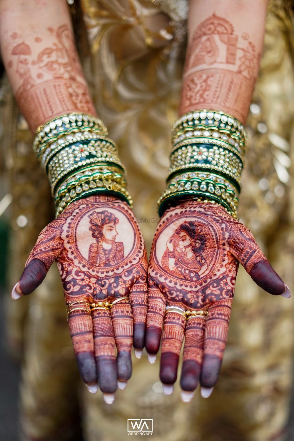 Photo of Mehendi design with bride and groom portraits on each hand