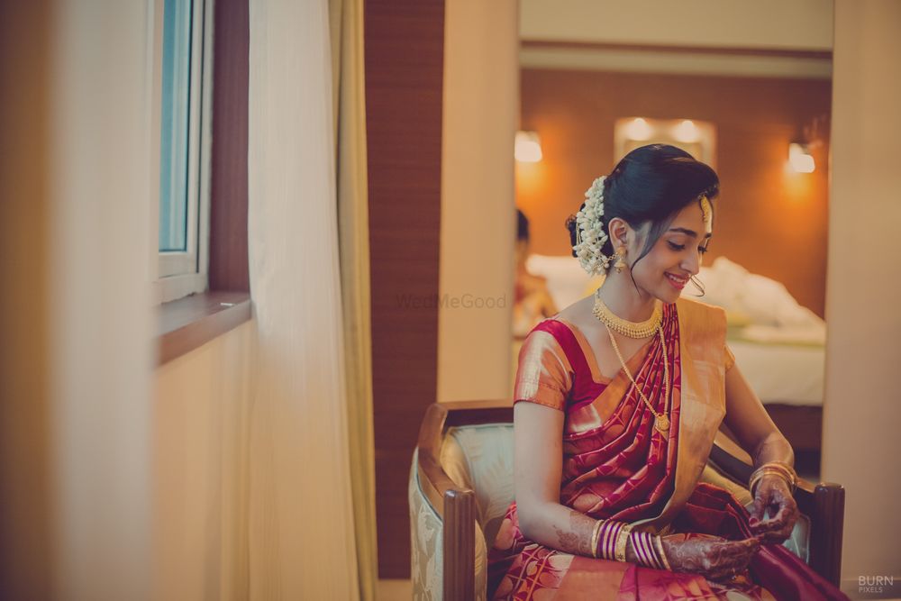 Photo of Candid Bride in Red Saree and Gajra