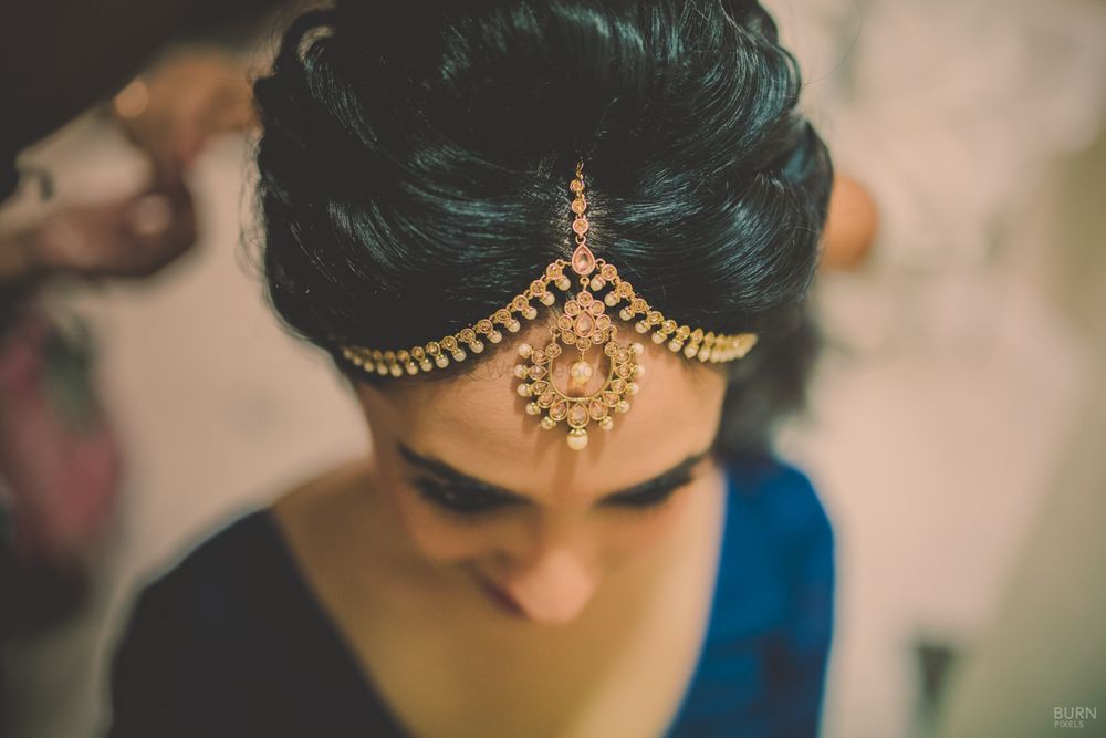Photo of Gold Pearl Strings Mathapatti on Puffed Hair