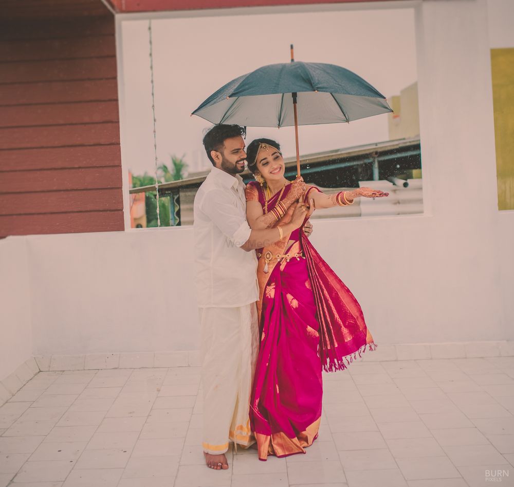 Photo of Couple Under the Umbrella Candid Shot
