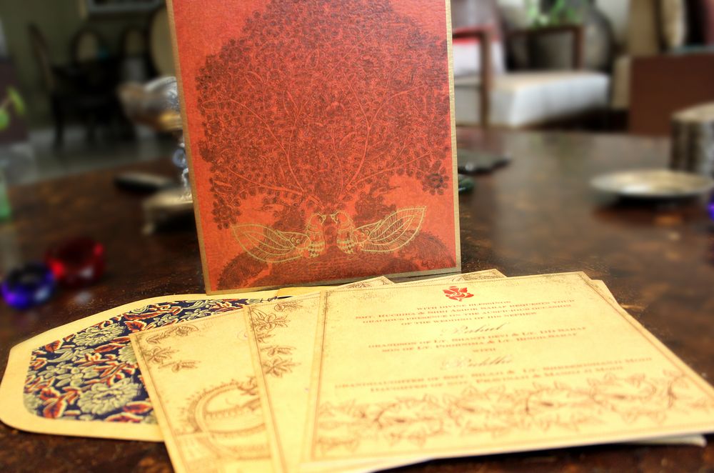 Photo of offwhite and rust wedding card