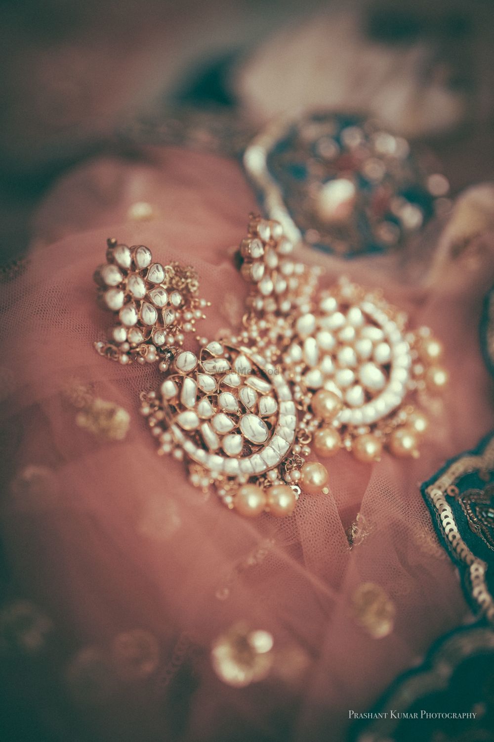 Photo of Earrings on dupatta bridal jewellery shot